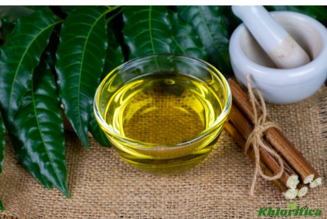 neem oil in transparent bowl with neem leaf